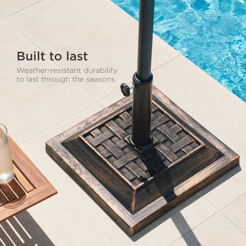 Heavy Duty 26 Pound Steel Patio Umbrella Stand With Bronze Finish Square Base Decorative Basket Weave Pattern Weather Resistant Resin Wind Resistant Fits 1.5 To 1.75 Inch Poles next to pool