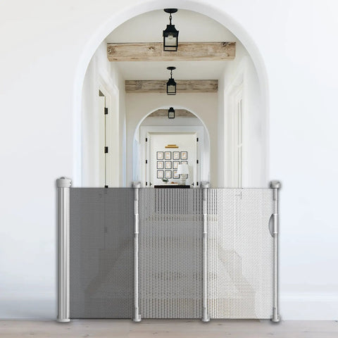 Retractable Baby And Pet Safety Gate 54 Inch Wide 34 Inch Tall for doorways in a home, gray color.