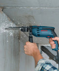 Using 120 Volt One Half Inch Hammer Drill With 7 Amp Motor Lightweight Workhorse Single-Speed 360 Degree Auxiliary Handle on concrete