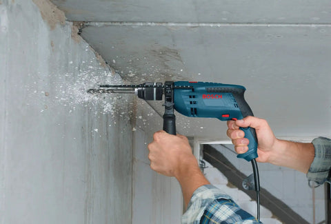 Using 120 Volt One Half Inch Hammer Drill With 7 Amp Motor Lightweight Workhorse Single-Speed 360 Degree Auxiliary Handle on concrete