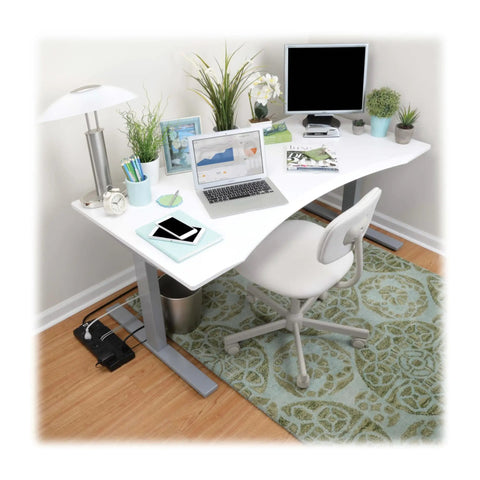 TLP1208TEL Home Theater Surge Protector Power Strip With 12 Outlets, Flat Plug, placed under a modern office desk setup.