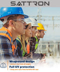 Four workers wearing 50 Pack Clear Safety Glasses For Men And Women, ANSI Z87.1 Eye Protection, at a construction site.