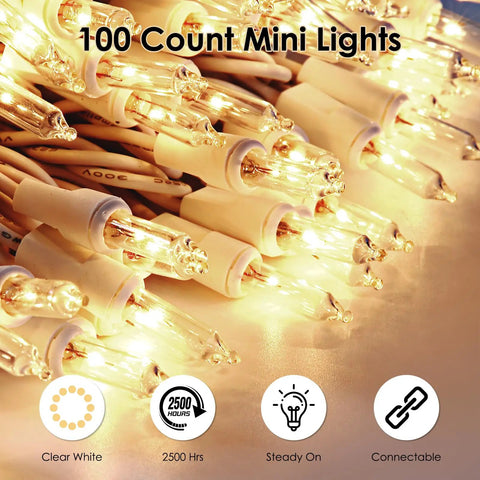 Close-up of 100 Count Clear White Wire UL Listed Connectable Warm White String Lights glowing on white wire.