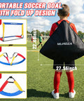 Child holding a folded Backyard Kid Friendly Soccer Goal Set Pack Of Two Portable Pop Up Nets with ball and cones for ages 3 to 8