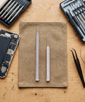 Premium Tungsten Steel Screw Extractor Kit For Knocking Out Stripped Broken Phone Screws 1.3Mm Drill Bit Tool on work surface with tools.