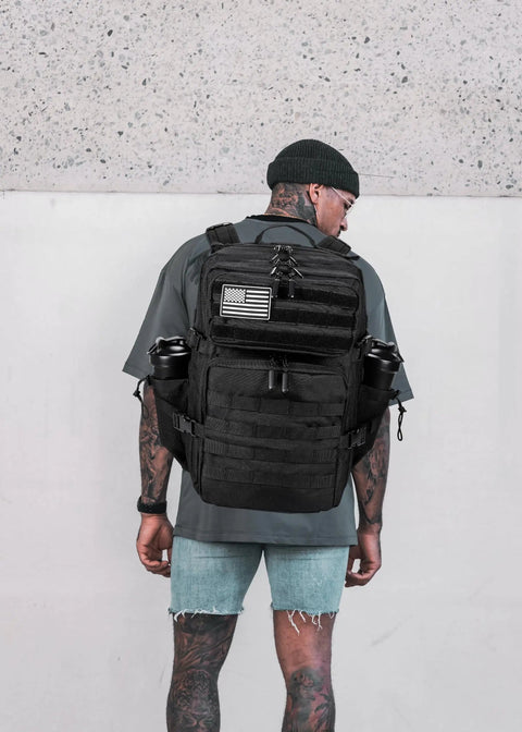 Rugged 45L Tactical Backpack for Men and Women With MOLLE System, shown on a man outdoors, demonstrating fit and style.
