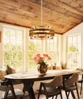 5 Light Metal Drum Chandelier With Wood Grain Shade Round Pendant Ceiling Light For Kitchen Island And Dining Room Rustic Farmhouse Style Nickel Finish E26 Base 9 Inch High By 19.7 Inch Wide Includes 47 Inch Chain illuminating a rustic dining area with wooden table and chairs.