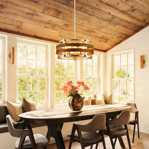 5 Light Metal Drum Chandelier With Wood Grain Shade Round Pendant Ceiling Light For Kitchen Island And Dining Room Rustic Farmhouse Style Nickel Finish E26 Base 9 Inch High By 19.7 Inch Wide Includes 47 Inch Chain illuminating a rustic dining area with wooden table and chairs.