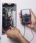 Person using GMT 318 Analog Multimeter With Six Functions And Fourteen Ranges Reads AC And DC Volts Up To 500V on circuit panel