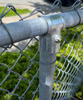 End Rail T Clamps For Chain Link Fence, Galvanized Steel Top Rail Hardware, Heavy Duty T Clamp Fit For One And Three Eighths Inch And One And Five Eighths Inch Pipes, Zinc Coated, Durable Fence Parts, 8 Pack installed on fence