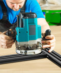 User operating Heavy Duty Aluminum Juice Groove Router Jig on a wooden surface for precise cutting.