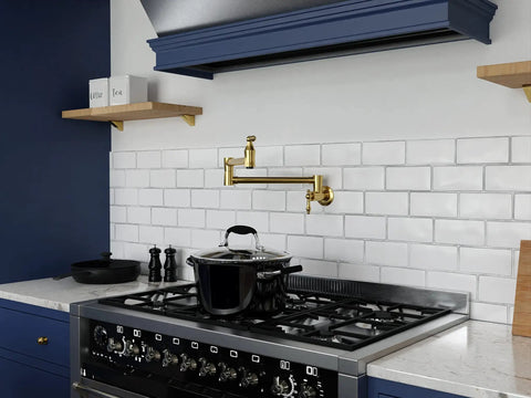 Wall Mount Pot Filler Faucet With 24 Inch Reach Pro Grade Dual Swivel Joints And Twin Handles Solid Brass Interior Stainless Steel Brushed Gold Finish Single Hole Install Wide Range Of Motion Dual Shut Off Valve over a black stove on a white backsplash