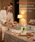 Woman relaxing in spa-like bathroom with White Tea Reed Diffuser Set Inspired by Westin Hotel Scent on tub edge