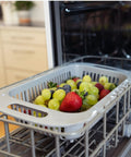 Gray basket with grapes and strawberries in a Straight Plug Countertop Dishwasher With No Fuss Setup And Lightning Fast Fifteen Minute Cycle.