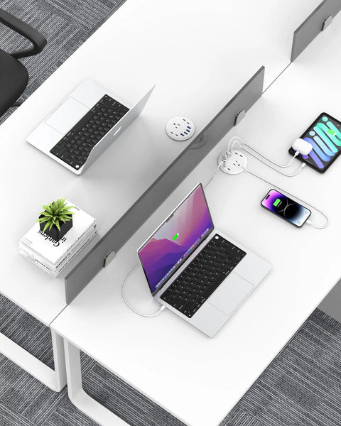3 Inch Recessed Desk Power Grommet With USB C 65W Fast Charging and Ultra Flat Plug Strip shown on a white desk with laptops and devices.
