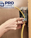 Installing ProConnex C500 Clamp Type Connector NM SE Three Eighths Inch on electrical box with yellow NM cable.