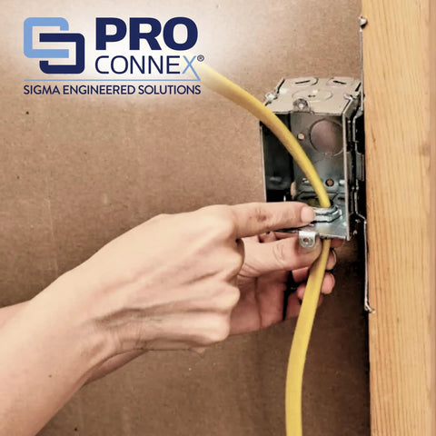 Installing ProConnex C500 Clamp Type Connector NM SE Three Eighths Inch on electrical box with yellow NM cable.