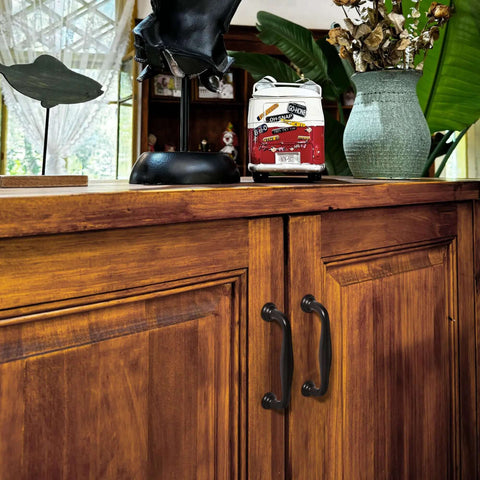 Score These Sweet Matte Black Cabinet Handles In A 10 Pack Featuring A Smooth 5 Inch Screw Spacing crafted from heavy duty zinc alloy on wooden cabinet doors.