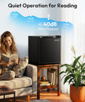 Compact One Point One Cubic Foot Upright Mini Freezer With Reversible Door And Adjustable Feet Hella Efficient Black Cold Storage For Ice Cream, placed next to a woman reading.