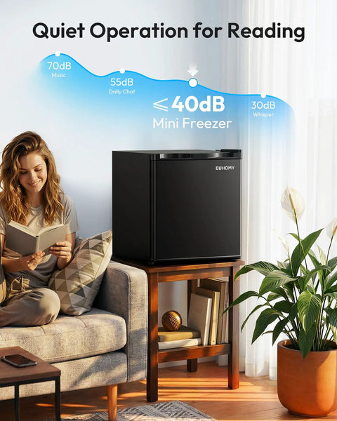 Compact One Point One Cubic Foot Upright Mini Freezer With Reversible Door And Adjustable Feet Hella Efficient Black Cold Storage For Ice Cream, placed next to a woman reading.