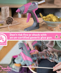 Real Deal Full Size Corded Hot Glue Gun Bundle With Stable Self Standing Base And 10 Heavy Duty Glue Sticks Made For Daily Crafts Or Weekend Warrior Diy Tasks Pink Grey 60W on a crafting table.