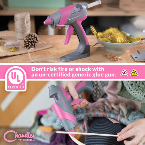 Real Deal Full Size Corded Hot Glue Gun Bundle With Stable Self Standing Base And 10 Heavy Duty Glue Sticks Made For Daily Crafts Or Weekend Warrior Diy Tasks Pink Grey 60W on a crafting table.