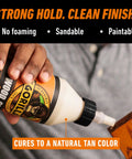 Person applying Ultimate Waterproof Wood Glue For Indoor And Outdoor Projects Pack Of 2 Natural Wood Color 18 Ounce Each