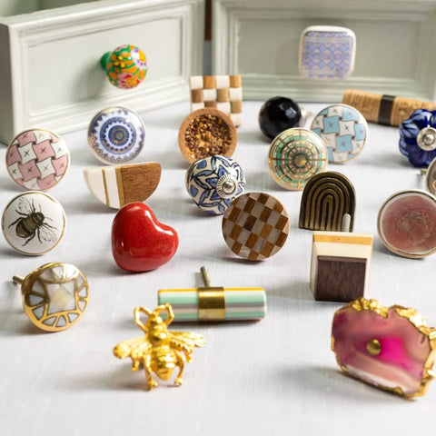 Assorted decorative and colorful ceramic drawer knobs including the 100 Pack Star White Ceramic Drawer Knobs for Cabinets and Doors Dope Kitchen Hardware Dressers Easy to Install Rust Free Durable Kid Friendly No Sharp Edges Classy Decor.