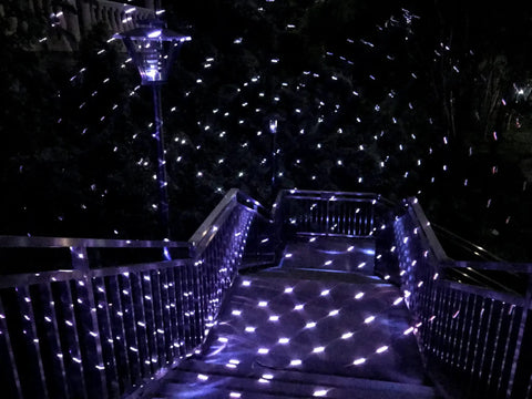 Bluetooth Motion Laser Lights With Dope 7 Color Full Spectrum White Star Effects creating pattern on outdoor stairs