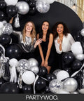 Three women posing with Black Balloons Party Pack 140 Pcs With 18 Inch 12 Inch 10 Inch And 5 Inch Balloons Arch Kit Garland