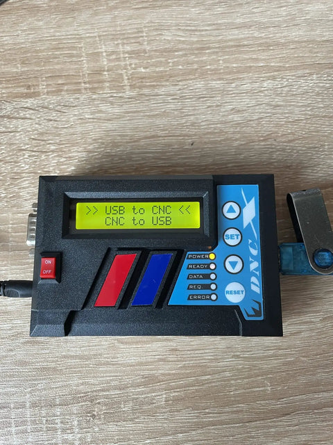 Drip Feed CNC Interface for Legacy CNC Machines with display showing USB to CNC program transfer and RS232 connectivity.