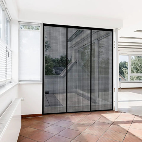 Heavy Duty Magnetic Screen Door With Self Sealing Magnets Hands Free Insect Shield For Patio And Bedroom Sliding Doors Up To 60 By 80 Inches Durable Fiberglass Mesh Black installed on sliding door in bright room.