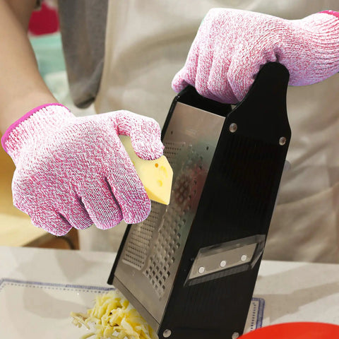 Cut Resistant Gloves Level 5 Food Grade For Kitchen Safety Medium Pink HPPE Knitted Fibers in use with a cheese grater