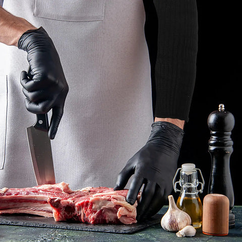High Density Cut Resistant Arm Sleeves Two Pack Legit Tough As Nails Forearm Guards used while cutting meat with a knife.