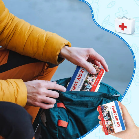 Person placing a mini first aid kit into a backpack, part of a 12 Pack Mini First Aid Kits Bulk Set With 26 Pieces Each In Sturdy Portable Case For Travel Car Home School Office And Sports Compact Grab And Go Safety Starter Kits.