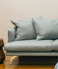 Gray sofa with golden sturdy metal furniture feet replacement legs for sofa, cabinet, coffee table and more, sleek look.