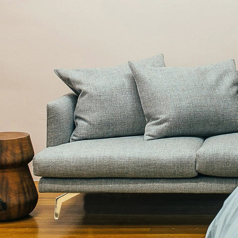 Gray sofa with golden sturdy metal furniture feet replacement legs for sofa, cabinet, coffee table and more, sleek look.