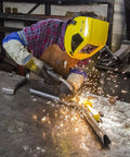 Magswitch Pivot Angle 200 welding magnet in use by welder with yellow helmet, sparks flying