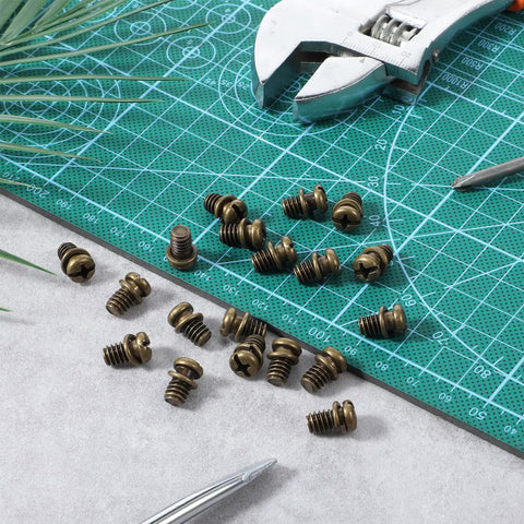 Twenty Pack Ceiling Fan Blade Screws 1/4-20 X 3/8 Phillips Pan Head Heavy Duty Carbon Steel Replacement Fasteners on green cutting mat.