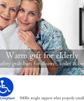 Glacier Collection 16 Inch Stainless Steel Bath Grab Bar Designer Safety Bar Matte Black Sleek Design ADA Compliant 500 Lb Load Capacity For Shower Or Tub Non Slip Comfort Grip And Easy Mount Durable Finish Built To Last visible near elderly person with caregiver