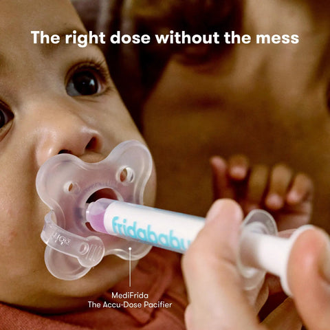 Baby using MediFrida medicine dispenser, part of the All In One Baby Health Care On The Go Travel Kit With NoseFrida Snotsucker Rectal Thermometer MediFrida Medicine Dispenser And Portable Carrying Case Ideal Gift Set For Parents