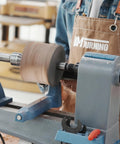 Four Prong Spring Loaded Spur Drive Center 2MT for wood lathe in action holding wood piece securely during turning