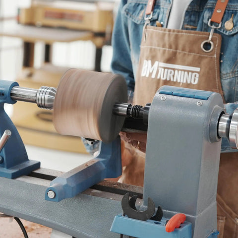 Four Prong Spring Loaded Spur Drive Center 2MT for wood lathe in action holding wood piece securely during turning
