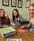 Three kids playing Play Smart Dice Math Tac Toe Game Sharpen Mental Math With A Fun Twist On A Timeless Classic Multilevel Math Bingo.