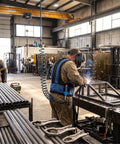 Air Compressed Cooling Vest For Industrial Crews Featuring Vortex Tube Tech worn by worker in welding shop, adjustable cotton oxford material.