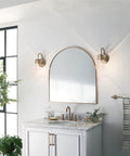 Bathroom scene with Brinley 11.5 Inch Wall Sconce In Champagne Bronze With Clear Glass Mason Jar Look 1 Light Industrial Farmhouse Style Vintage Wall Mount Light For Living Room Bedroom Hallway Entry beside mirror
