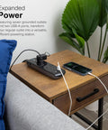 7-Outlet Surge Protector With 2 USB Ports, 3 Ft Flat-Plug Extension Cord, 1780-Joule Protection in use on wooden table