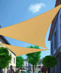 Triangle Shade Sail 12 Ft By 12 Ft By 17 Ft Sand Outdoor UV Blocking Canopy for Backyard with buildings and trees