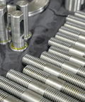 Double Ended Stud Screws Set M3x100mm in 304 Stainless Steel With Nuts, Flat Washers, and Lock Washers displayed on table