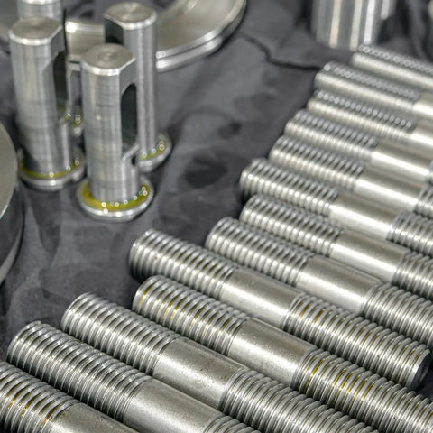 Double Ended Stud Screws Set M3x100mm in 304 Stainless Steel With Nuts, Flat Washers, and Lock Washers displayed on table